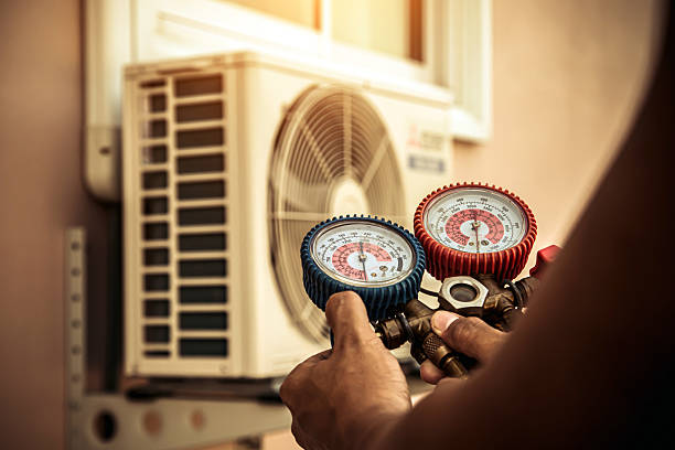 Professional Air Conditioning Service technician working in Cowlesville, NY